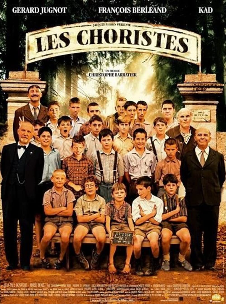 Movie poster of "Les Choristes" with the title and cast in school uniforms framed by an archway, featuring Gérard Jugnot and François Berléand