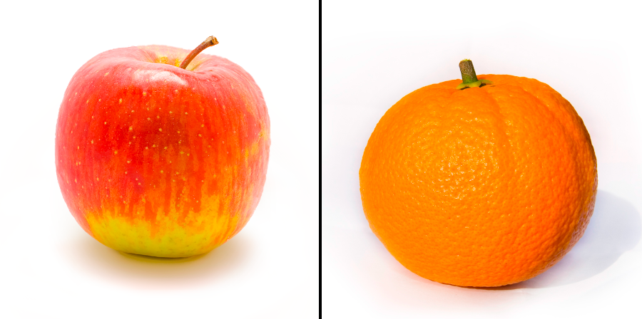 Red and green apple on the left, with an orange on the right, against a white background