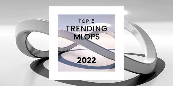 Graphic with "TOP 5 TRENDING MLOPS 2022" on white paper, highlighted by rotating grey elliptical shapes on a grey background